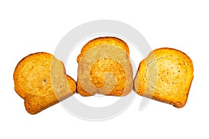 Three rusks of white bread on a white background