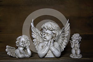 Three sad angels: decoration for bereavement. photo