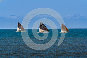 Three sailboats