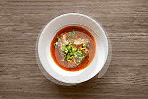 Three sardines in tomato sauce sprinkle on top with coriander and spring onion