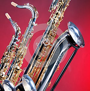 Three Saxophones on Red