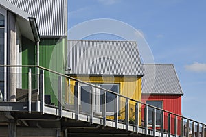 Three scandinavian style colored wooden houses