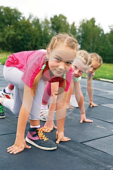 Three schoolgirls are at the start