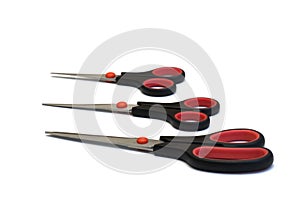 Three scissors on white