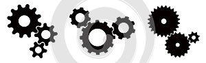 Three sets of black cogs gears on white background