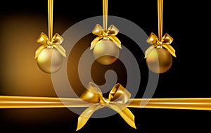 Three shining Christmas golden decorations baubles hanging on satin ribbons with bows on dark backgroung with light and