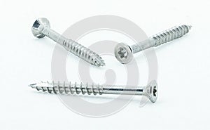 Three shiny stainless steel wood screws