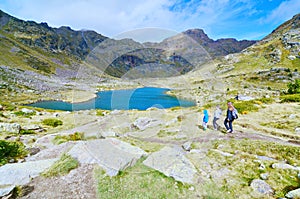 Three siblings hiking to Estany Primer in Tristaina, Andorra