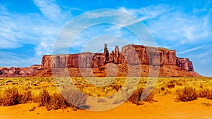 The Three Sisters and Mitchell Mesa, a few of the many massive Red Sandstone Buttes and Mesas in Monument Valley photo