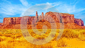 The Three Sisters and Mitchell Mesa, a few of the many massive Red Sandstone Buttes and Mesas in Monument Valley photo