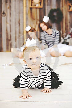 Three sisters posing in white crowns