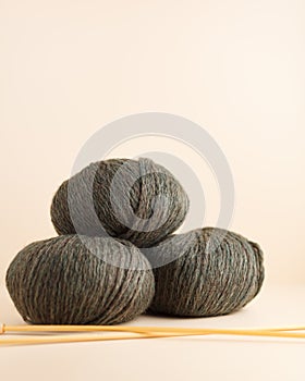 Three skeins of yarn. Nice photo for a hobby, vertical orientation. Hobby aesthetics.