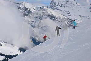 Three skiers traversing