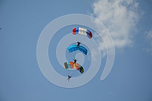 Three skydivers in the air