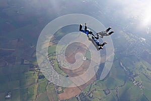 Three skydivers in freefall