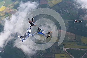 Three skydivers in freefall