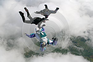 Three skydivers in freefall