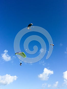 Three skydivers in the sky, Cuba, Varadero