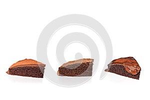 Three slice chocolate cake isolated in white background.