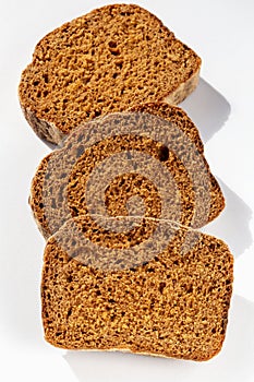 Three slices of bread on white background close up