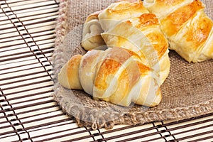 Small croissants  with checkered napkin in background