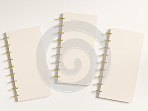 Three small disc bound planner covers with blank space for customization