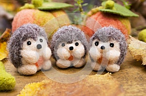 Three small felted hedgehogs