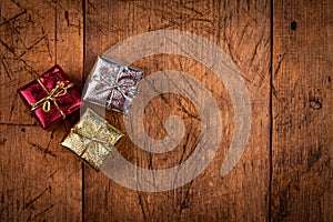 Three small gift box on vintage wooden table