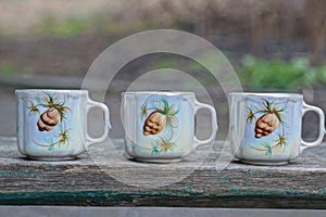 three small white coffee ceramic cups