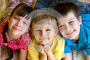 Three smiling children