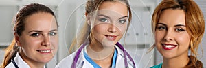 Three smiling female medicine doctors in office looking in camera portrait