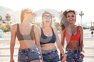 Three smiling happy girls having fun on vacation.