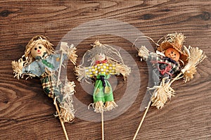 Three smiling scarecrows