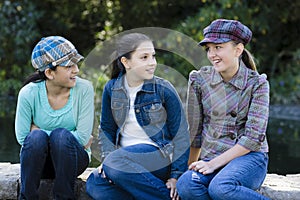 Three Smiling Tween Girls Outdoors