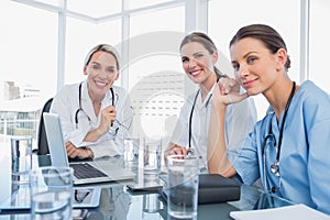 Three smiling women doctors