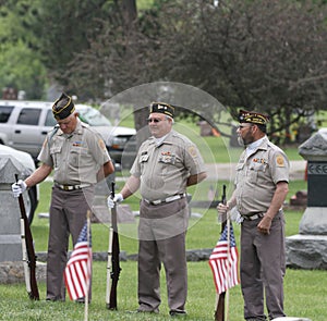 Three Soldier Veterans in graveyard