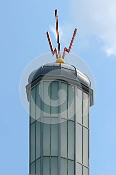 Three sparks, a symbol of electrical discharge on a lightning rod on a rooftop