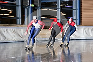 Three speed skaters photo