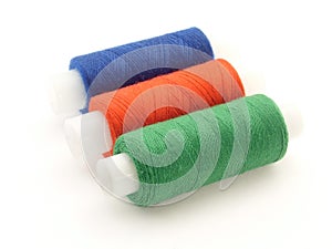 Three spools of thread