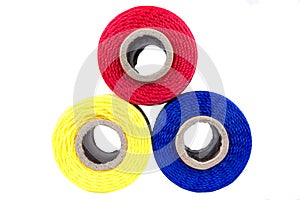 Three spools of thread isolated
