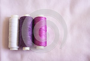 Three spools of thread for sewing