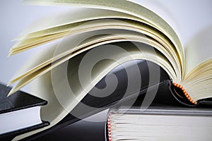 Three stacked books on white background