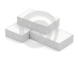Three stacked white rectangular blocks on a plain background