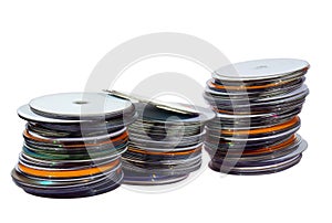 Three Stacks of Colorful Compact Discs on White