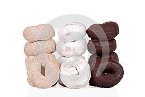Three stacks of fresh donuts