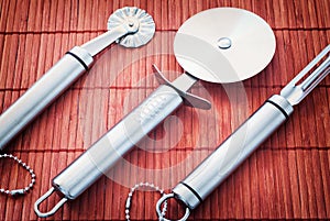 Three stainless steel kitchen tools