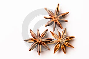 Three star anise spice pods on white color.