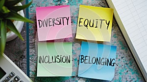 Three Sticky Notes Core Values of Diversity Equity Inclusion Belonging photo