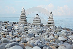 Three stone stacks on pebble beach