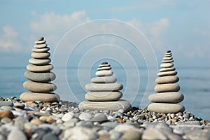 Three stone stacks on pebble beach photo